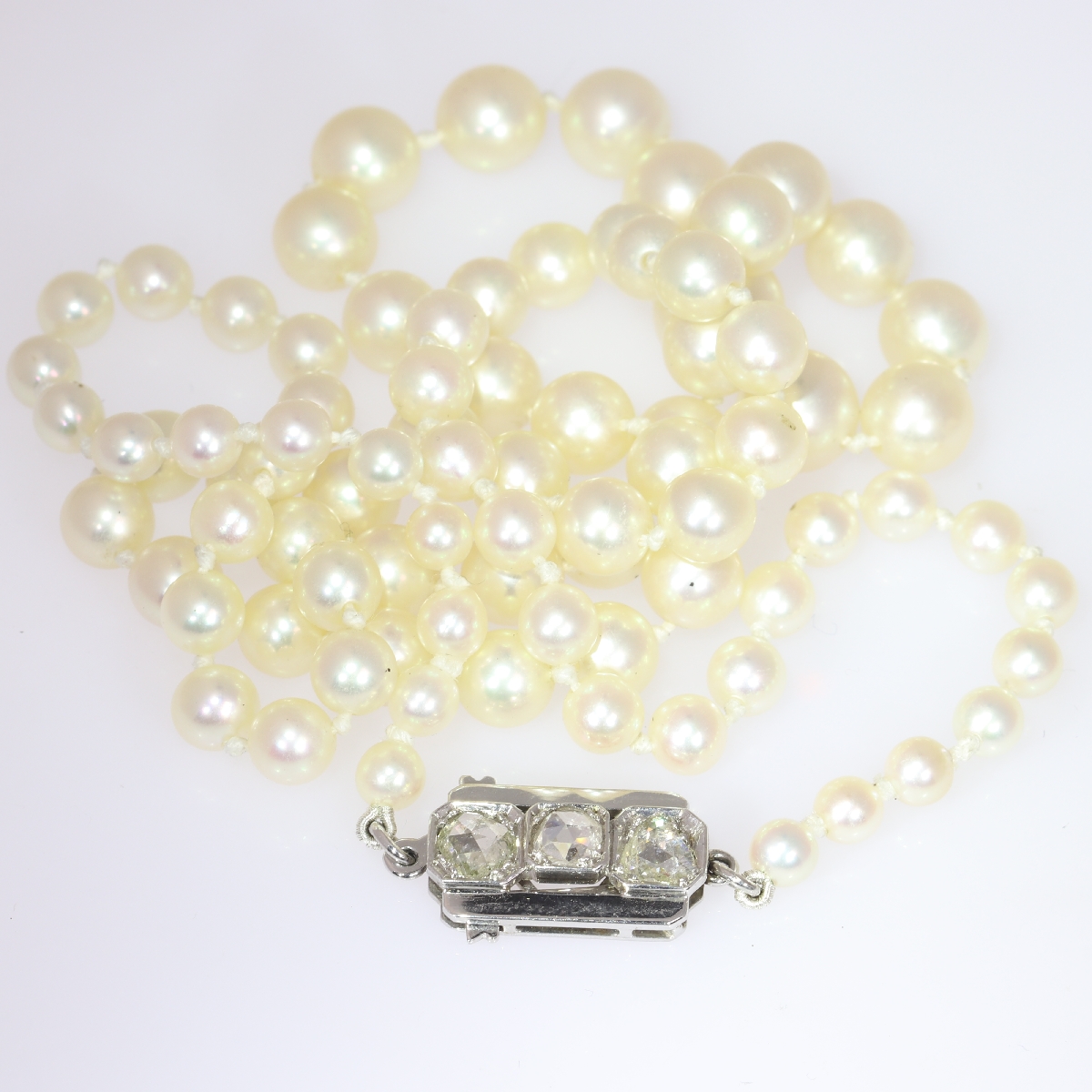 Estate pearl necklace with white gold closure set with rose cut diamonds